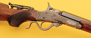 Exquisitely engraved receiver and checkered pistol grip. More on the interesting Patent Midrange tang sight in the text.